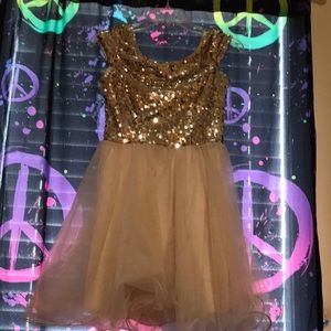 Gold sequins dress.